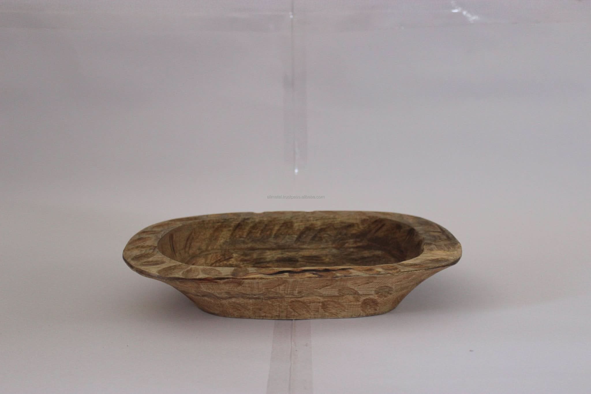Rustic wood decorative bowl with carved details, ideal for home decor.